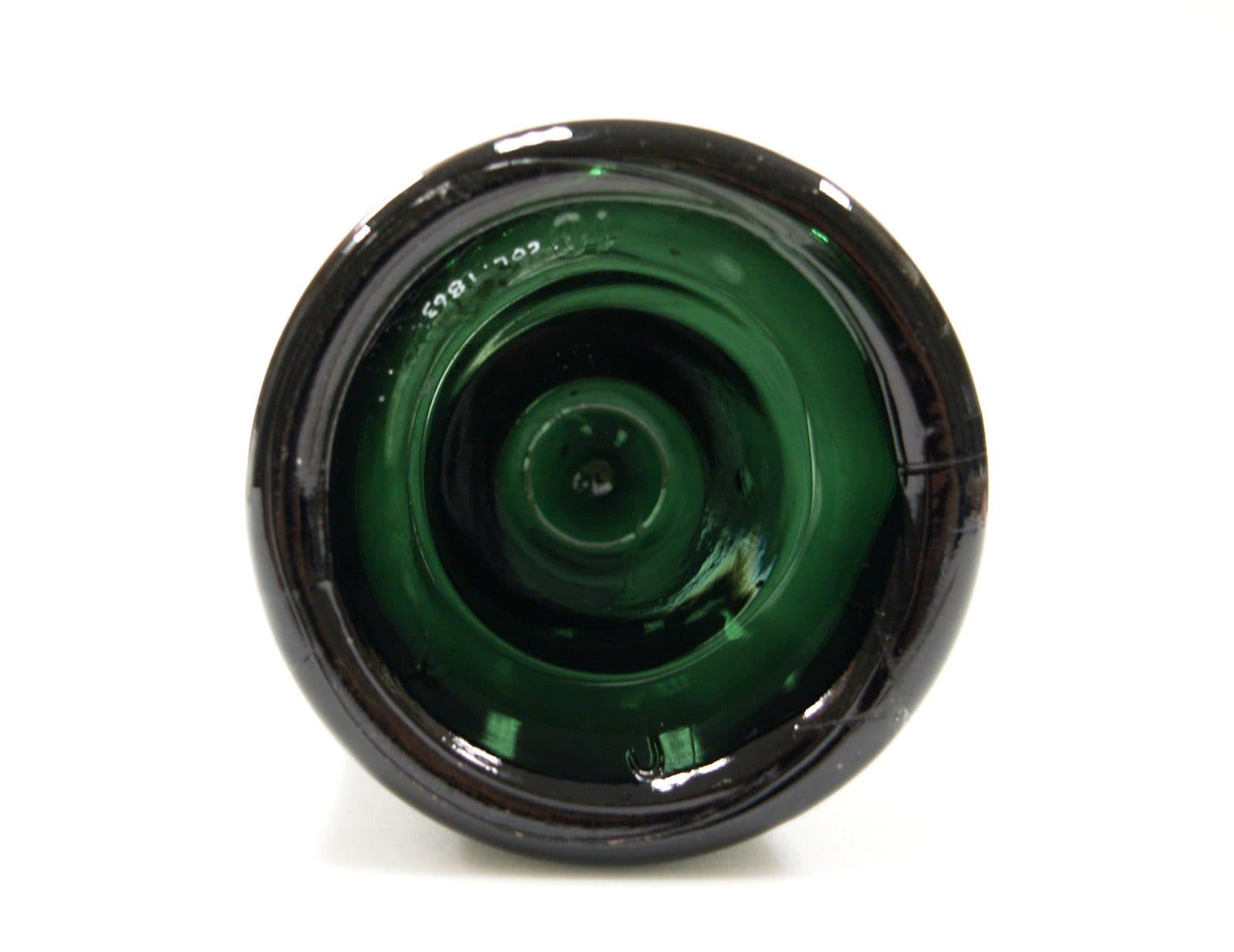 The base of an antique green bottle with a deep kick-up