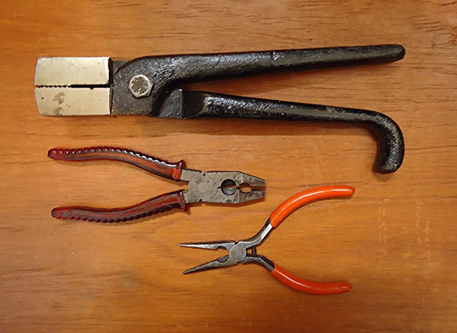Jewelry pliers and wire on the workbench