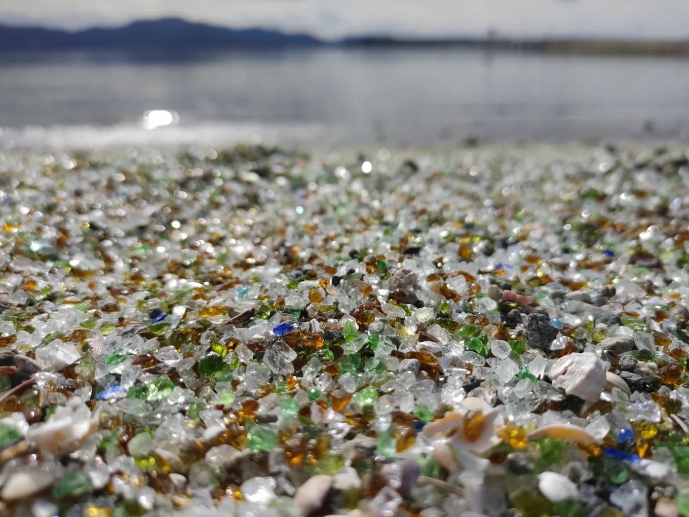Recycled glass sand and shells beside Omura Bay, Japan