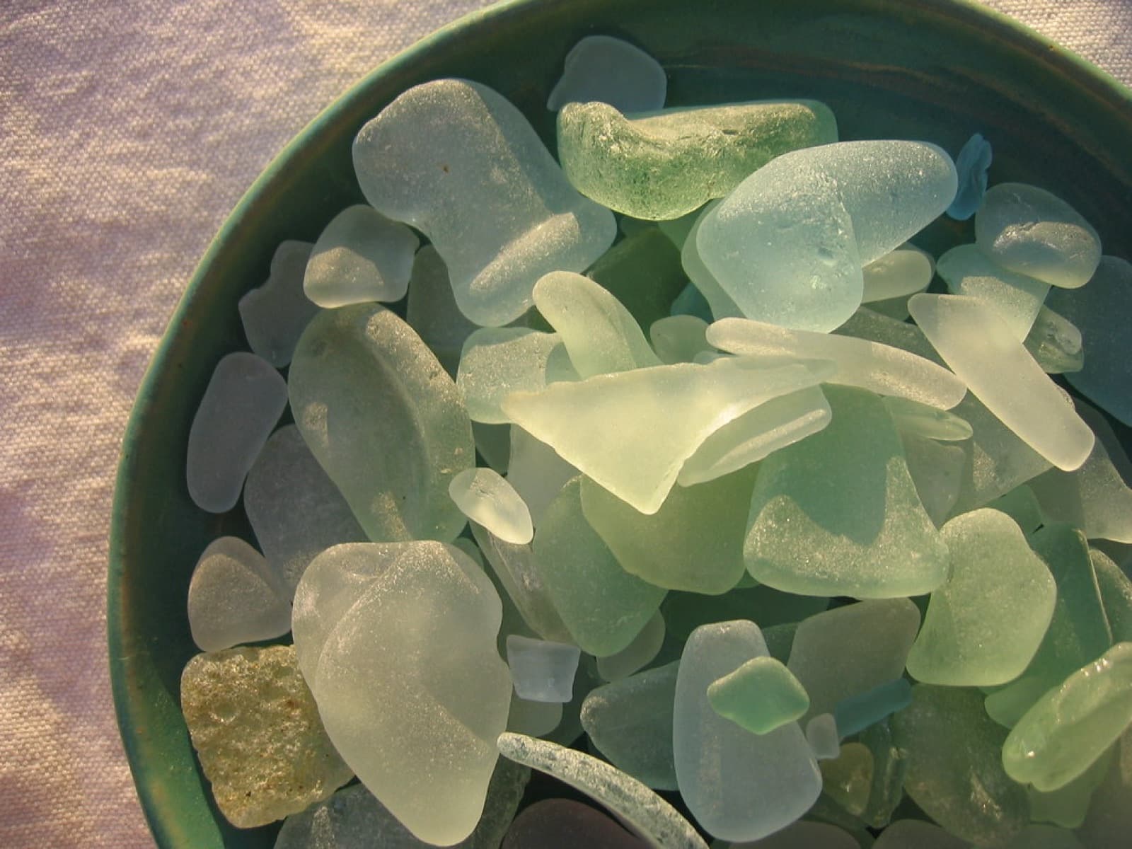Frosted sea glass pieces collected in a bowl
