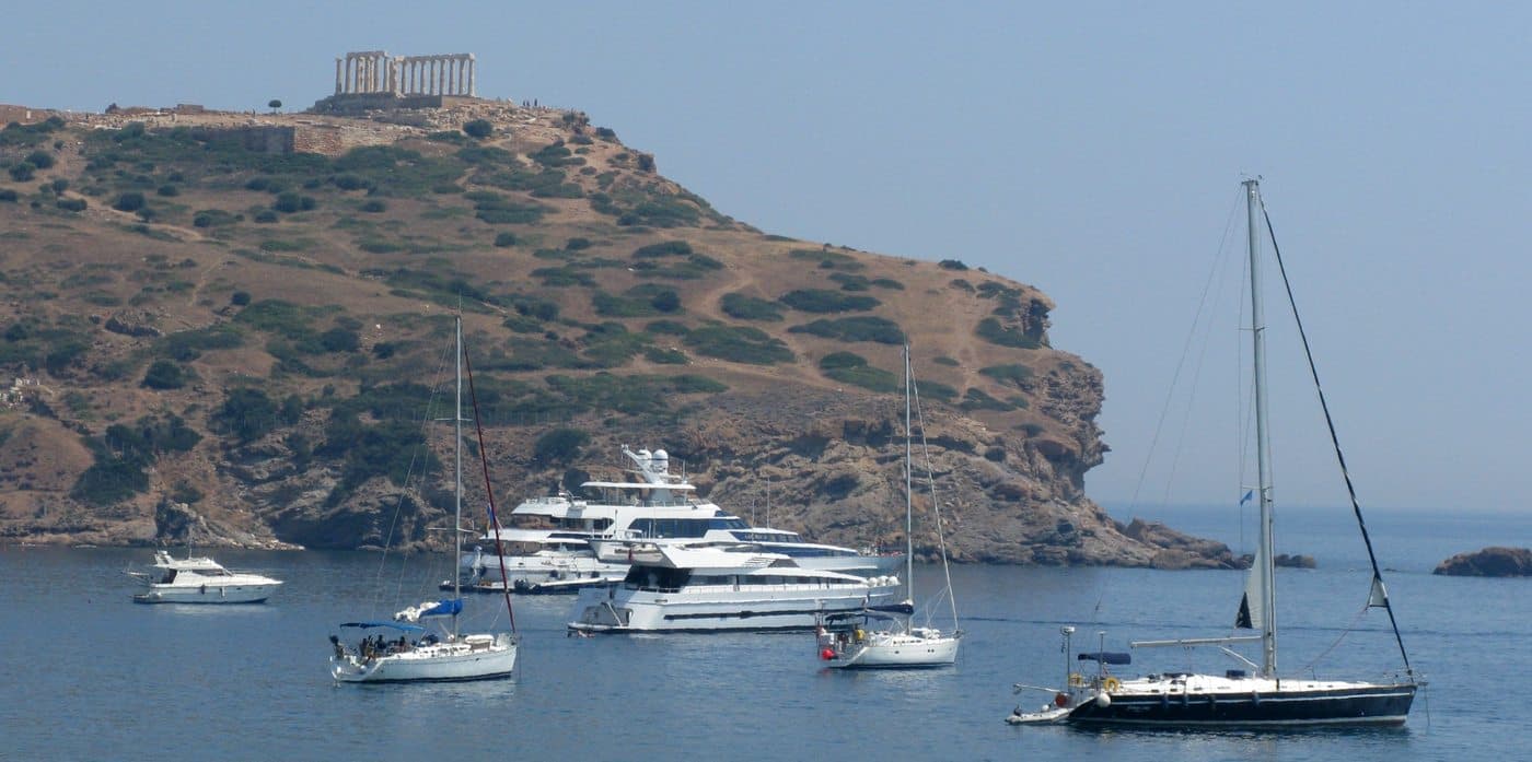 Yachts at anchor below the Temple of Poseidon at Cape Sounion